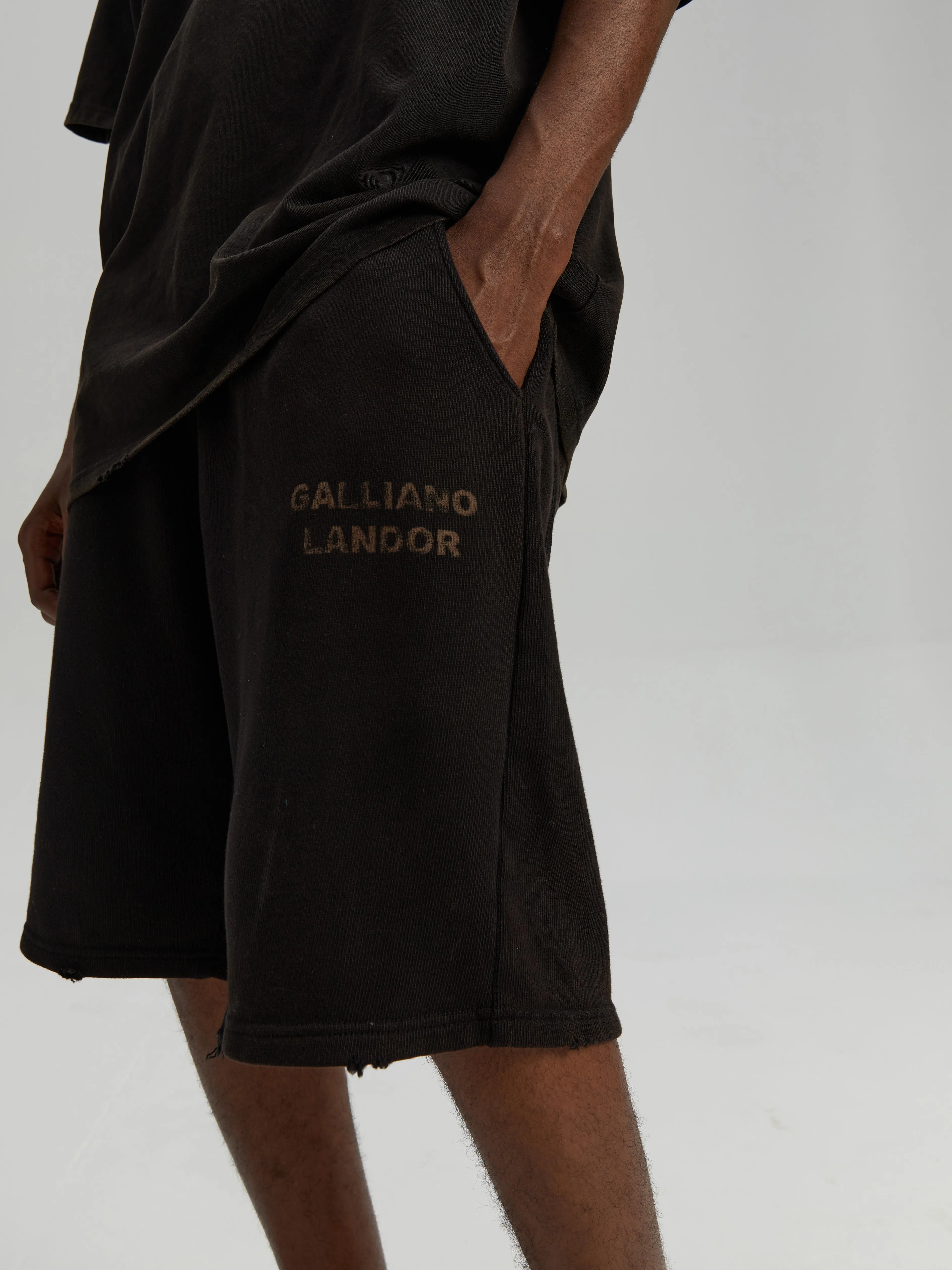 Black antique brass patina logo shorts