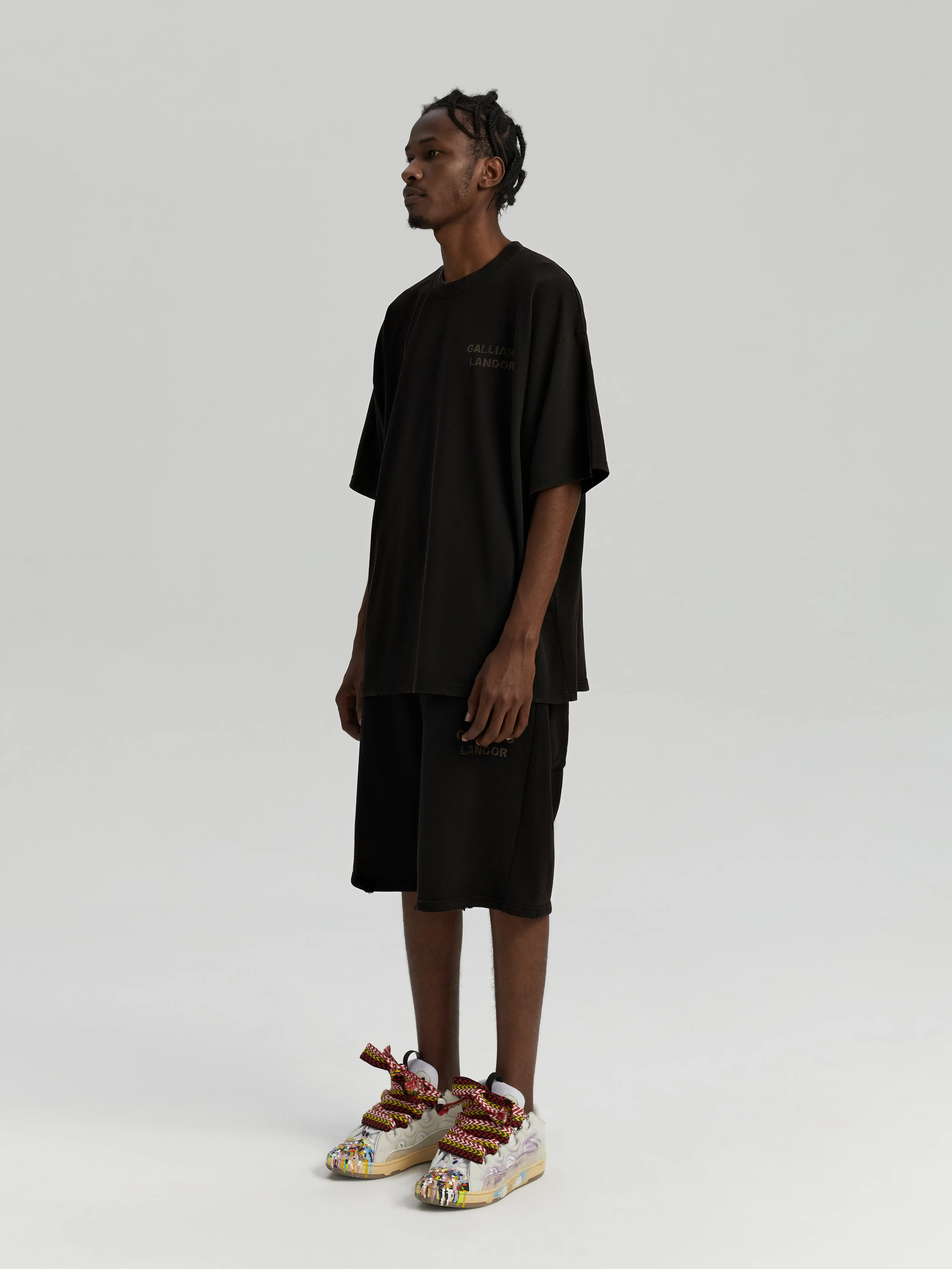Black antique brass patina logo shorts