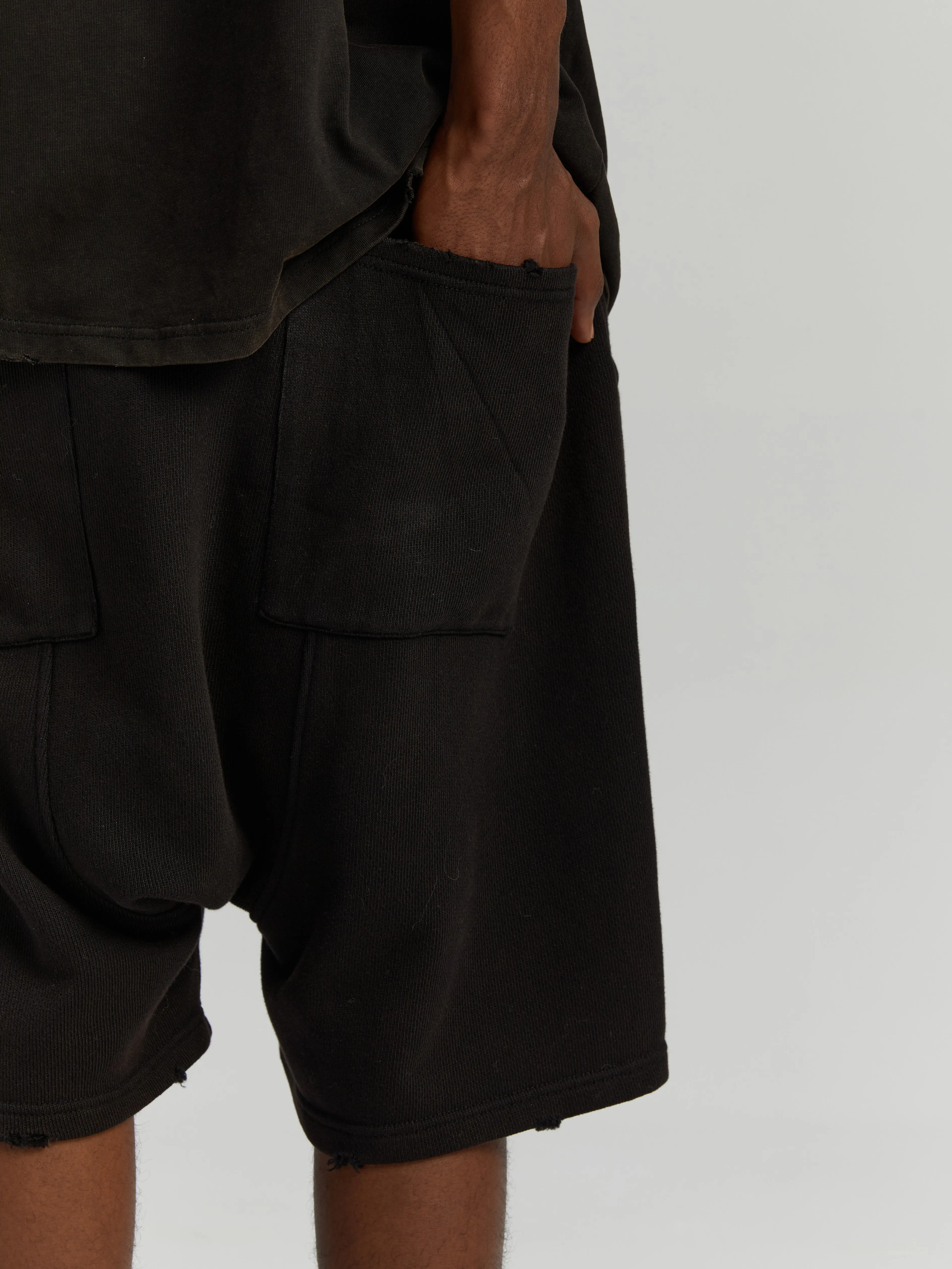 Black antique brass patina logo shorts