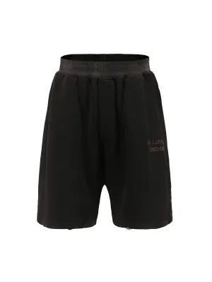 Black antique brass patina logo shorts