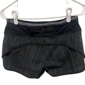 Lululemon women's size 4 speed up shorts black and white white stripped 4&quot;