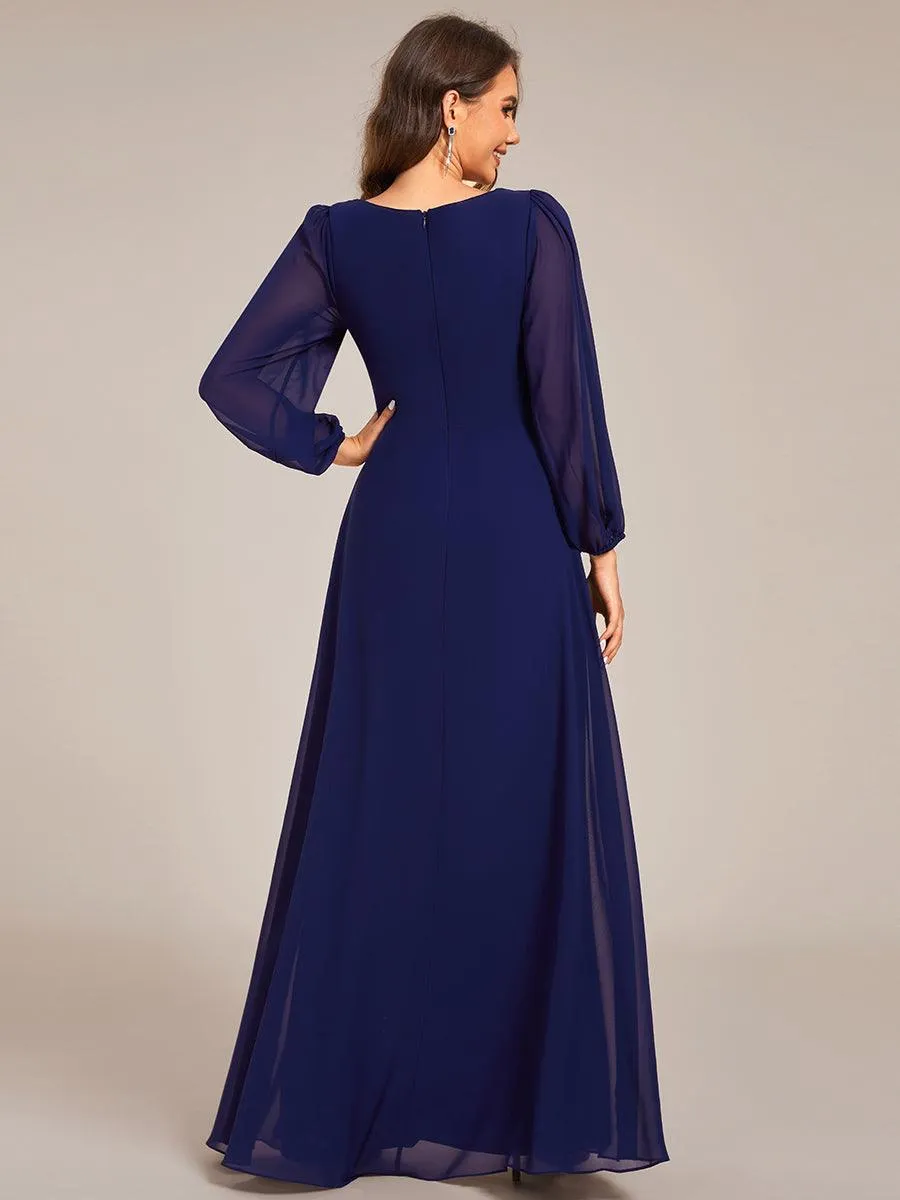 Robe de soirée élégante en mousseline de soie à manches longues et plissée