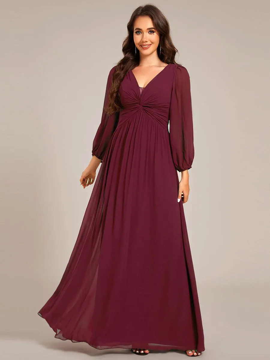 Robe de soirée élégante en mousseline de soie à manches longues et plissée
