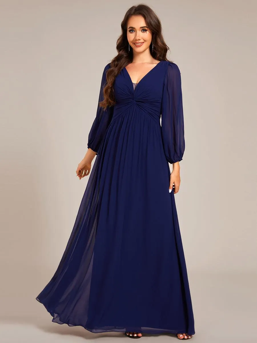 Robe de soirée élégante en mousseline de soie à manches longues et plissée